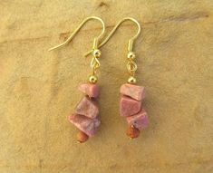 Rhodochrosite earrings gemstone earrings chip earrings pink earrings pink gemstone earrings gifts. These beautifully crafted earrings feature rhodochrosite chip beads and wooden beads on gold plated hook wires. Rhodocrosite is a popular gem with a subtle dusty pink colour. The earrings have a 4cm drop and the chip beads average 5-8mm in size. Pink Pendant Earrings As Gift, Nickel-free Dangle Jewelry For Her, Elegant Earrings With Gemstone Beads, Elegant Gemstone Beads Earrings For Gift, Jewelry With Matching Round Bead Earrings For Gifts, Jewelry With Matching Round Beaded Earrings For Gifts, Pink Wire Wrapped Jewelry For Jewelry Making, Gemstone Drop Earrings As A Gift For Her, Gold Gemstone Beads Jewelry Gift For Her