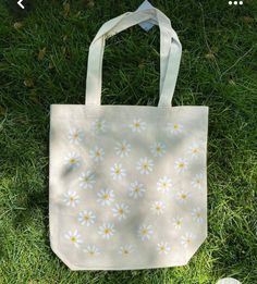 Bag with lots of daisies. - 100% cotton - Long shoulder straps - Washable at 30-40 degrees, delicate wash, easy care (turn inside out) Eco-friendly Cotton Bags For Spring, Trendy Cotton Canvas Bag For Spring, Casual Cotton Flower-shaped Bag, Casual Cotton Canvas Bag With Adjustable Straps, Everyday Cotton Flower-shaped Shoulder Bag, Casual Cotton Canvas Bag For Spring, Cotton Flower-shaped Shoulder Bag For Everyday Use, Flower-shaped Cotton Shoulder Bag For Everyday Use, Trendy Cotton Bags With Floral Print