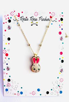 Hop into Easter with this playful bunny necklace by Rosie Rose Parker. With its cute and kitschy charm, celebrate the holiday in style. Perfect for adding a touch of quirky fun to your outfit. Cute Charm Necklaces For Gifts, Playful Charms Necklace For Gifts, Playful Charms Necklace For Gift, Playful Charm Necklaces For Valentine's Day Gift, Playful Charm Necklaces For Gifts, Fun Charm Necklaces With Lobster Clasp For Gifts, Fun Necklaces With Lobster Clasp For Gift, Cute Handmade Charm Necklaces For Valentine's Day, Handmade Cute Charm Necklaces For Valentine's Day