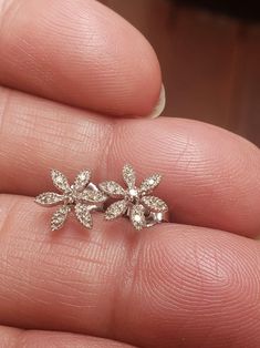 VTG precious all 14k white gold with rhodium finish and diamond flower stud earrings. Each earring has 7 melee diamonds, 14 total stones. 1 larger approximately 2mm in center and 1 approximately 1-1.5mm on each of 6 flower petals. Estimated .04tcw. H/I color S12/I1 clarity. Each post stamped 14k MEXICO, securely fitting brand new backs stamped 585. This pair are petite with incredible attention paid to detail. Seen through loupe gold flowers are entirely saw-toothed and diamond cut with tiny bea Vintage Diamond Earrings, White Gold Diamond Earrings, Radiant Diamond, Gold Diamond Earrings, Complimentary Colors, Flower Stud, Flower Petal, Diamond Flower, Flower Earrings Studs