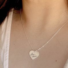 Small heart sterling silver pendant. Engrave this piece front and back with your own handwriting, fingerprints, doodles or important dates. ▪️ Qty: 1 Necklace ▪️ Material: Sterling Silver ▪️ Pendant Measures: .75" x .75" (19mm x 19mm) ▪️ Chain: 1.7mm Sterling Cable Chain (Choice of length) ▪️ Satin brushed texture For good visibility, stay within a 5 word limit (per side) when personalizing this piece. Stamped Sterling Silver Heart Pendant Necklace, Silver Hand Stamped Heart Necklace For Anniversary, Sterling Silver Hand Stamped Heart Pendant Necklace, Sterling Silver Hand Stamped Heart Necklace, Hand-stamped Sterling Silver Heart Pendant Necklace, Hand Stamped Sterling Silver Heart Pendant Necklace, Personalized Silver Heart Necklace For Memorial, Stamped Sterling Silver Heart Pendant Jewelry, Personalized Sterling Silver Heart Necklace With Round Pendant