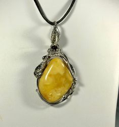 Welcome to my gemstone shop. I guarantee that all my items are handmade by our store member and made of genuine natural real Baltic Amber gemstone.   Rare White / Honey Yellw colour Natural Baltic Amber. Genuine amber pendant. Medium size. 10,9 grams 5 cm 2.5 cm It is raw amber handmade by me. Nice and a bit shiny and flat, all parts are Gold-Plated Sterling silver 925, with hallmarks. This item is made of natural not pressed amber.  Baltic Amber is a natural gemstone. Amber is surprisingly ligh Handmade Adjustable Baltic Amber Jewelry, Unique Baltic Amber Jewelry For Gifts, Baltic Amber Pendant Jewelry Gift, Baltic Amber Gemstone Necklace Gift, Baltic Amber Gemstone Necklaces For Gifts, Baltic Amber Pendant Jewelry For Gift, Amber Oval Pendant Jewelry, Hallmarked, Baltic Amber Gemstone Necklace For Gift, Gift Natural Stones Baltic Amber Necklaces