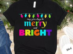 Merry and Bright Christmas Shirt, Merry Christmas shirt, Christmas gift, Holiday shirt, Neon Christmas shirt, Christmas carols, Santa Claus Cute and bright Christmas shirt!  Show your Christmas spirit with this bright and colorful tee!  Please visit my shop for more fun Christmas shirts and gifts.   Bella Canvas 3001 Unisex tee -- please see size chart in photos for measurements   Please note: Photos are mock-ups and design positioning may vary slightly in production.  Also, colors on monitors a Bright Christmas Lights Shirt, Fun Christmas Shirts, Neon Christmas, Merry And Bright Christmas, Christmas Carols, Bright Christmas, Merry Christmas Shirts, Holiday Shirt, Mock Ups