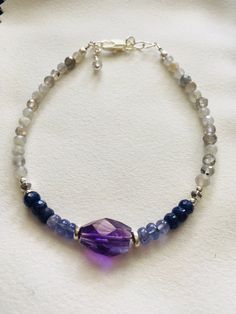 "Beautiful shades of purple and blue with glittery faceted  Labradorite.  The gems are genuine and gorgeous.  All strung on quality jewelry wire for strength and longevity.  The size is adjustable from 7-1/2\" to 8\", if you need a different size please contact me." Jewelry Wire, Amethyst Bracelet, Shades Of Purple, Quality Jewelry, Wire Jewelry, Labradorite, Blue And Purple, 925 Silver, Jewelry Bracelets