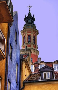 an old building with a clock tower in the background