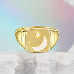 The crescent represents the cycles of life.  New beginnings will flourish for you always--wear this ring a reminder of the cyclical nature of the universe. Shine bright like the sparkling midnight sky! Let this moon and star signet ring speak to your soul, with its gorgeous moon hand set in a signet ring accompanied by a delicate dusting of stars.Carat Weight: 0.019 ctStone Size: 1.3 mmStone Type: Jeulia® StoneNumber of Stones: 1 Stone Shape: RoundStone Color: Diamond WhiteWeight: 4.8 gWidth: 3. Celestial Moon Phase Ring For Anniversary, Celestial Moon Ring For Anniversary, Moon Shaped Celestial Promise Ring, Celestial Crescent Rings As Gift, Mystical Crescent Ring As A Gift, Celestial Crescent Rings For Gifts, Mystical Crescent Rings Perfect For Gifts, Celestial Ring With Moon Charm For Anniversary, Gold Celestial Ring With Moon Phase