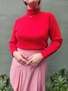 * This is a truly lovely sweater. It is 75% Lambswool, 15% angora, and 10% nylon. It is really soft, cozy, warm, and fluffy. The drop shoulder design is so flattering and feminine. The soft shoulders are nicely constrasted with the structured mock/turtle neck collar. It is not cropped, but on the shorter side of a full length sweater. Perfect for tucking into bottom without too much bulk.  * Measurements (inches/flat) Shoulder to shoulder - armpit to armpit - 19.5 Canter front length - 20 Waist Fitted Wool Retro Tops, Fitted Retro Wool Top, Retro Fitted Wool Top, Red Wool Sweater For Workwear, Red Wool Sweater For Work, Retro Winter Workwear Tops, Red Soft Knit Turtleneck Sweater, Red Cashmere Sweater With Fine Knit, Classic Red Fine Knit Sweater