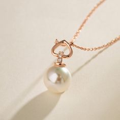 Material: 18K Rose Gold, Akoya pearl, and Diamonds Akoya saltwater cultured pearl Pearl size: 8.5-9.0mm Weight of diamonds: 3 diamonds, around 0.019ct in total Chain length: 45cm (adjustable 22.5cm) Handpicked of every pearl, only the top 1% of pearls are selected Handcrafted Lifetime warranty Handcrafted Elegant Rose Gold Pearl Jewelry, Rose Gold Pearl Pendant Necklace In Fine Jewelry, Rose Gold Pearl Pendant Necklace Fine Jewelry, Fine Jewelry Rose Gold Necklace With Pearl Pendant, Luxury Rose Gold Pearl Chain Jewelry, Pear-shaped Rose Gold Jewelry With Diamond Accents, Elegant Rose Gold Jewelry With Pearl Charm, Elegant Pearl White Heart Necklace, Rose Gold Pearl Jewelry For Formal Occasions