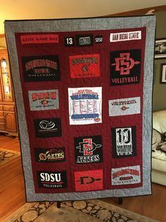 a quilt with many different sports logos on it