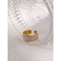 This golden metallic abstract design enamel BOHO open cut finger ring offers an exquisite and unique combination of vintage and bohemian style, perfect for the fashionista looking to make a statement. Its intricate design, crafted from luxurious enamel, adds a touch of sophistication and chic that will instantly elevate any outfit. Details Item Type: Fashion Rings Metal Type: Stainless Steel+Gold Plated Material: Enamel Size: 21*12mm Unique Gold Enamel Ring, Trendy Adjustable Gold Enamel Ring, Gold Enamel Open Ring, Trendy White Enamel Rings, Handmade Gold Enamel Open Ring, Gold Handmade Enamel Open Ring, Handmade Gold Open Enamel Ring, White Bohemian Metal Rings, Trendy Gold Enamel Open Ring