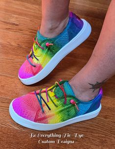 Lighten your step and slip into comfort and style with custom colored HEY DUDE Cody style sneakers! Hand-colored with a beautiful meld of bright rainbow tones, these gorgeous shoes will turn heads! With the eyelet upper and rainbow elastic laces plus beads for a secure fit, this Cody sneaker is one of cutest and comfiest shoes out there. With a removable memory foam insole and this shoe offers ergonomic comfort and cushioning, the ultralight outsole sets you free to explore in comfort and style! Sporty Multicolor Slip-on Sneakers With Round Toe, Trendy Multicolor Lace-up Custom Sneakers, Trendy Multicolor Sneakers With Vulcanized Sole, Colorful Casual Lace-up Sneakers, Comfortable Multicolor Slip-on Sneakers, Multicolor Custom Sneakers With Vulcanized Sole, Sporty Multicolor High-top Slip-on Sneakers, Casual Low-top Custom Sneakers With Elastic Laces, Multicolor High-top Sporty Slip-on Sneakers