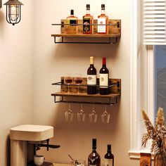 two shelves with bottles and glasses on them