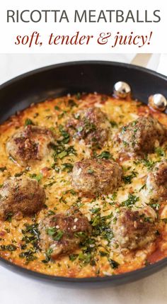 a pan filled with meatballs and sauce on top of a table