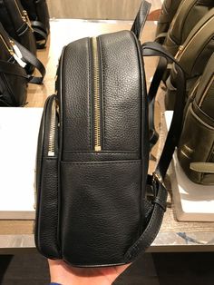 Michael Kors Women's Abbey Medium Studded Leather Backpack Black 35T8GAYB2L Pebbled leather with studded accent 100% polyester lining Gold tone hardware Zip closure Exterior features 1 zip pocket in front and 2 slide pockets on side Interior features 1 zip pocket, 1 large slip pocket and 2 multi-function slip pockets 23cm (W) x 30cm (H) x 11cm (D) Michael Kors Backpack For On-the-go, Designer Leather Backpack With Branded Hardware, Luxury Black Bags With Metal Zipper, Luxury Leather Backpack With Gold-tone Hardware For Travel, Luxury Leather Travel Backpack With Gold-tone Hardware, Luxury Leather Backpack For Travel With Gold-tone Hardware, Luxury Backpack With Zipper Closure, Luxury Standard Backpack With Zipper Closure, Michael Kors Leather Backpack With Zipper