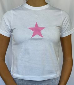 "Star baby tee 100% cotton available in sizes xs - xl - see photo 5 for sizing Model is wearing size S and is a 6/8 - For reference, model is 5'5 with 31\" bust and 26\" waist" Trendy Summer T-shirt With Star Patch, Crew Neck Tops With Star Logo For Summer, Graphic Tee With Star Logo For Summer, Summer Cotton T-shirt With Star Patch, Trendy Fitted Tops With Star Print, Spring Graphic Tee With Star Print, Y2k Star Print Tops For Streetwear, Cotton T-shirt With Star Print For Summer, Casual Summer Tops With Star Logo