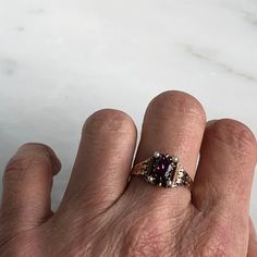 Details: Beautiful Victorian Garnet and Seed Pearl ring set in lovely 14K rose gold. The band is adorned in lovely abstract filigree engraving. The stone has great depth, and has a lovely rich pink tint to the garnet. It is surrounded by 4 seed pearls. The garnet measures 7.5mm x 5mm. There are no internal markings. Measurements: Ring measures a size 7 3/4 US. It can be re-sized for a fee. Condition: The overall all condition of this ring is very good. Please ask all questions prior to placing a Oval Rose Gold Ruby Ring With Rose Cut Diamonds, Elegant Pink Gold Rings With Accent Stones, Elegant Rose Gold Engraved Ring, Victorian Rose Gold Ruby Ring, Fine Jewelry Amethyst Ring In Rose Gold, Rose Gold Amethyst Ring Fine Jewelry, Rose Gold Fine Jewelry With Intricate Design For Wedding, Rose Gold Engraved Diamond Cut Ring, Victorian Hallmarked Rose Gold Ruby Ring