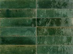 green tiles with rusted edges are seen in this image