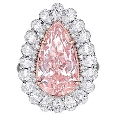 'THE ROSE DIAMOND' is an extraordinary natural pink pear shaped diamond ring. The Pink diamond is certified with a GIA certificate, which also includes a GIA Type IIA certificate. Type IIA diamonds are the most chemically pure diamond, extremely rare and only represent 1-2% of natural, earth grown diamonds. IGI Report No. 4706041761 is for whole ring. Details: Center stone: 5.59ct Pear shape Light Pink VVS1 natural diamond, 16.85 x 9.29 x 5.77 mm. 20 Pear shape White Diamonds D-E-F VVS1-VS2 side Pear Shape Engagement Ring, Pear Shaped Diamond Engagement Rings, Pear Cut Diamond Ring, Pear Shaped Diamond Ring, Pink Sapphire Ring Engagement, Gia Certificate, Pink Diamond Ring, Pear Shaped Ring, Platinum Diamond Engagement Rings