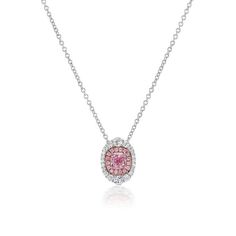 This pendant necklace is crafted in 18 Karat white and rose gold. Featuring a GIA graded pink-purple diamond with SI1 Clarity and totaling 0.50 Carats. Accenting the center diamond are round pink diamonds of VS Clarity totaling 0.07 Carat. Surrounding the diamond halo are round diamonds of VS Clarity and F Color totaling an additional 0.29 Carats. This pendant is on a adjustable chain measuring 16-18 inches long. Pink Brilliant Cut Platinum Jewelry, Pink Platinum Jewelry With Brilliant Cut, Luxury Pink Diamond Cut Jewelry, Exquisite Pink Gemstone Necklace, Exquisite Pink Gemstone Necklaces, Pink Platinum Jewelry Gift, Formal Pink Diamond Necklace, Luxury Pink Sapphire Diamond-cut Jewelry, Oval Pink Sapphire White Gold Jewelry