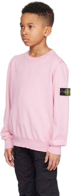 12 gauge knit organic cotton sweater. · Rib knit crewneck, hem, and cuffs · Pinched seam at armscyes · Detachable felted logo patch at sleeve · Machine-wash Supplier color: Pink Supplier code: 8016501B2 Model measures 53” / 134.6 cm tall and wears size 10Y. Stone Island Junior Size : child's height 2Y: 36 / 92 cm 3Y: 38.5 / 98 cm 4Y: 41 / 104 cm 5Y: 43.5 / 110 cm 6Y: 45.5 / 116 cm 8Y: 50.5 / 128 cm 10Y: 56 / 142 cm 12Y: 61.5 / 156 cm 14Y: 67 / 170 cm Fall Sweater With Logo Patch, Fall Long Sleeve Sweater With Logo Patch, Winter Long Sleeve Sweatshirt With Logo Patch, Crew Neck Sweater With Logo Patch For Fall, Fall Crew Neck Sweater With Logo Patch, Crew Neck Sweater With Logo Patch For Winter, Winter Crew Neck Sweater With Logo Patch, Winter Cotton Sweater With Logo Patch, Winter Crew Neck Sweatshirt With Logo Patch