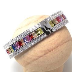 Material:100% 925 Sterling Silver Plated Main stone: Lab Created Red Topaz Gemstones (Garnet) Other stone: Lab Created Blue, Yellow, Morgan, White Topaz Gemstones (Morganite, Citrine, Sapphire) Width: 3/5 inches Size: 8 inches Condition:New Main color:Multicolor Quantity:1 Pc This multicolor bracelet is made with lab created red, blue, yellow, pink, morgan and white topaz gemstones and 100% 925 sterling silver plating for better quality and prolonged shine! Please check my other beautiful silver Morganite Bracelet, Red Topaz, Multicolor Bracelet, Jewelry Manufacturers, Topaz Gemstone, Gemstone Bracelets, White Topaz, Morganite, Italian Charm Bracelet