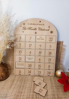 a wooden calendar sitting on top of a table