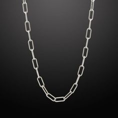 Inspired by classic and original motifs, our modern Paper Clip Link Chain is a versatile accessory that can be dressed up or down. Paper Clip Chain is also a good choice when you want to add a touch of subtle luxury to your everyday look. Paper Clip Link Chain Chain Width: 6mm Wide Chain Length: 26" and 30" Core Material: Stainless Steel Finish: Silver PVD Coated Clasp: Lobster Closure Minimalist Paperclip Chain Necklace For Formal Occasions, Elegant Metal Necklace For Everyday Use, Elegant Everyday Metal Necklace, Modern Necklaces With Rectangular Silver Chain, Classic Metal Chain Necklace For Everyday, Silver Formal Paperclip Chain Necklace, Modern Necklace With Rectangular Silver Chain, Modern Link Chain Necklace For Formal Occasions, Formal Silver Paperclip Chain Necklace