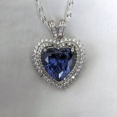 "This gorgeous Sterling Silver cubic zirconia studded Tanzanite heart necklace and earring set would make the perfect classy gift for a bridesmaid, as an anniversary gift, for Valentine's Day or for Mother's Day.  Tanzanite is the birthstone for those born in December, making it a thoughtful birthday gift as well! Pictures were taken both indoor and outdoors to best represent color. ~Measurements~ The heart pendant measures 1\" tall and 3/4\" wide.  The Tanzanite heart stone is 12mm x 12mm.  The Heart Of The Ocean Necklace, Sapphire Heart Necklace, Born In December, Well Pictures, Titanic Jewelry, Tanzanite Jewelry, Tanzanite Earrings, Jewelry Heart, Heart Stone