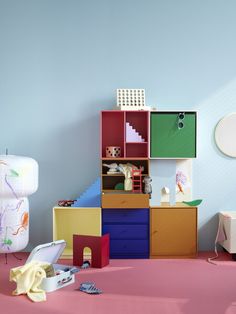 a room with colorful furniture and accessories on the floor