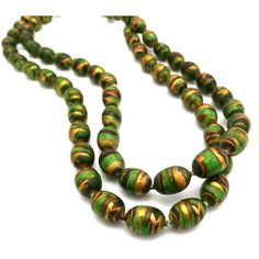 The paper mache beads on this rare retro vintage necklace almost glow with vibrant color! This retro vintage necklace's color combines deep and bright greens with metallic greens, coppers, golds, and browns in striations on each bead. Each hand-painted bead is 3/8" long, and it is knotted between each one for a total length of 35". This would be a great necklace to mix with other autumn colors. This vintage necklace is a beauty and would make a great Gatsby Costume or a Downton Abbey one. It is Great Gatsby Costume, Gatsby Costume, Green Copper, Great Gatsby, Downton Abbey, Green Bead, Paper Mache, Bright Green, Gatsby