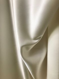 "Gorgeous and luxurious NATURAL WHITE silk charmeuse. Much lovelier up close, rich color. Silk satin with crepe back. 30 mm, which is denser and OPAQUE. Perfect for evening wear or bridal gown. \"What is Momme in silk fabric? Mommes (mm), is a unit traditionally used to measure the weight of silk fabrics. One momme = 4.340 grams per square meter; 8 mommes is approximately 1 ounce per square yard or 35 grams per square meter.\" Imported. Sold by the yard. $45 per yard 45 inch width. Dry clean. 10 Luxury Elegant Raw Silk Fabric, Aesthetic Therapy, Materials Gown Style, Moon Fabric, Small Business Cards, Minimalist Apartment, Gown Style, Silk Fabrics, Greek Style