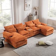 an orange sectional sofa in a living room