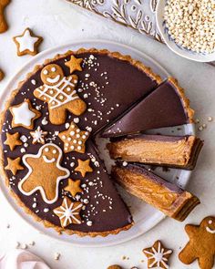 a chocolate cheesecake with gingerbread cookies on top