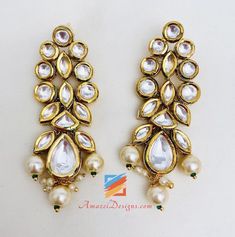 Ravishing Heavy High Quality White Kundan Set Necklace Earring Tikka Set. - High Quality Original Kundan Set - Necklace with Hanging Beads - Small Earrings - Small Elegant Tikka Shop for more KUNDAN SETS. Why Amazel Designs? Customer Testimonial - Aisha, Canada My experience with Amazel designs was amazing! She was super nice and the product was just as expected. It was beautiful and the quality was great! Thank you for the excellent and fast service! :) I will definitely be ordering more stuff! Temple Jewelry Beaded Earrings For Parties, Elegant Festive Beaded Chandelier Earrings, Elegant Chandbali Beaded Earrings, Elegant Beaded Chandbali Earrings, Elegant Beaded Bridal Earrings For Festivals, Elegant Beaded Danglers For Celebration, White Hand Set Chandelier Earrings For Celebrations, Elegant Jewelry Sets With Dangling Beads For Celebration, Festive Elegant Beaded Earrings