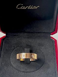 Lovely Cartier Love Ring in yellow gold and diamonds , decorated with of engraved screw patterns. Signature: Cartier and numbered (0.5 mm width).  Weight: 10.1 grams Ring US size: 9.5   Very good antique conditions. Thank you for visiting Boudoir Vintage!   Please feel free to contact me for further information or photos.  I offer international shipping. Your item will be packed with extreme care and will be shipped within 3-5 working days. If you are dissatisfied with your item, please feel free to contact me and would be happy to assist.  If you are interested in paying in installments or reserve an item, please send me an inquiry. To continue visiting my shop, please visit  https://www.etsy.com/shop/BoudoirVintageBijoux/ FOLLOW ME on Instagram: https://www.instagram.com/boudoir_vintage/ Cartier Love Ring Gold On Hand, Cartier And Tiffany Rings, Luxury Engraved Cartier Jewelry, Luxury Cartier Jewelry For Promise Ring, Luxury Cartier Fine Jewelry Rings, Cartier Love Ring With Engagement Ring Diamond, Cartier Timeless Luxury Wedding And Engagement Rings, Luxury Timeless Cartier Wedding And Engagement Rings, Real Cartier Love Ring