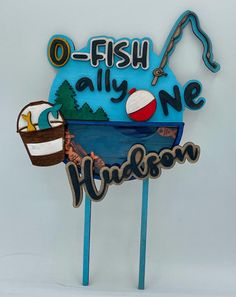 there is a sign that says o - fish ally one with a beach ball on it