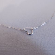 Tiny Sterling Floating Heart Necklace Silver Heart by West9th, $15.00 Delicate Sterling Silver Heart Necklace For Anniversary, Simple Silver Heart Necklace For Valentine's Day, Silver Dainty Necklace With Heart Beads, Silver Dainty Double Heart Necklace, Dainty Silver Heart Necklace With Heart Beads, Silver Dainty Heart Necklace For Valentine's Day, Dainty Silver Heart Beaded Necklace, Dainty Silver Heart Necklace For Valentine's Day, Simple Silver Heart Necklace As Gift