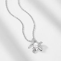 Description & Details Embrace the beauty of the sea with our meticulously crafted pieces that capture the essence of starfishes in stunning detail. From elegant starfish pendants to intricate starfish necklaces, our collection offers a range of styles to suit your unique taste. • Material: Solid 925 Sterling Silver ∙ Pearl ∙ Cubic Zirconia • Finish: Hypoallergenic ∙ Gold Plating•Dimensions: 40 - 45 cm chain , adjustable• All our work is custom made by hand with love Elegant Starfish Charm Jewelry For Gifts, Elegant Starfish Charm Jewelry As Gift, Elegant Starfish Charm Jewelry Gift, Silver Starfish Necklace For Gift, Ocean-inspired Star Necklaces For Gifts, Sterling Silver Starfish Charm Pendant Necklace, Sterling Silver Pendant Necklace With Starfish Charm, Elegant Silver Star Charm Necklaces, Elegant Silver Necklace With Star Charm