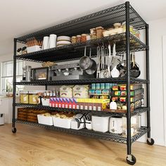 an organized kitchen with black shelving and lots of food