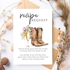 a recipe card with boots and flowers on it next to some dried flowers, an envelope that reads recipe request please bring your favorite recipe