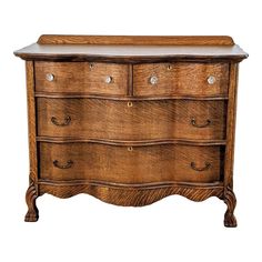 an old wooden dresser with drawers and knobs on the bottom drawer, isolated against a white background