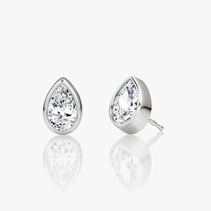 The Bezel Solitaire Studs combine vintage-inspired detail and modern appeal together for a look that’s timelessly elegant. Pear Earrings, Jewellery Showroom, Bespoke Rings, Solitaire Studs, Accessories Jewelry Earrings, Pear Cut, Three Stone, Diamond Shapes, Ring Designs