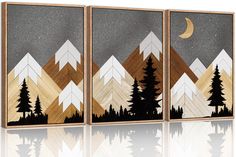 three canvases with mountains and trees painted on them, one has a moon in the sky