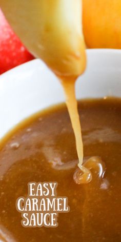 a spoon pouring caramel sauce into a white bowl with apples in the background and text overlay that reads easy caramel sauce