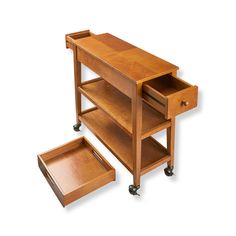 a wooden table with two drawers and one drawer on the bottom, sitting next to another shelf