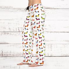 Add custom style to any loungewear collection with these custom-printed  Dachshund pajama pants. Their 100% polyester jersey knit fabric, along with the relaxed fit, makes for the ultimate comfort choice while kicking back at home. Meanwhile, the back elastic with the drawstring tie creates the perfect fit while the all-over-print adds a stylish dimension unique to your taste.  .: 100% polyester .: White seam thread .: Light fabric (6 oz/yd² (203 g/m .: Relaxed comfort fit .: Back elastic and black drawstring tie .: Sewn-in care label .: Assembled in the USA from globally sourced parts                                  XS           S          M          L          XL        2XL Waist width, in13.5014.4915.5116.7317.9919.25 Outseam, in       39.2540.0040.2440.6340.9841.38 Inseam, in      29. Playful Cotton Sweatpants For Loungewear, Multicolor Cotton Sleepwear Pants, Multicolor Cotton Sleepwear Long Pants, Playful Relaxed Fit Sweatpants For Loungewear, Printed Cotton Bottoms For Pajama Party, Cotton Printed Bottoms For Pajama Party, Comfortable White Pants For Pajama Party, Casual Multicolor Sleep Bottoms, White Playful Relaxed Fit Bottoms