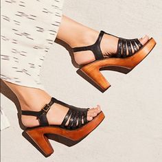 Free People Haven Clog Strappy Leather Clogs Featuring An Adjustable Ankle Strap. Wood Platform Padded Footbed Rubber Outsole Care/Import Import Measurements Heel: 4 In Color: Black, Runs Small Chic Ankle Strap Clogs With Removable Insole, Chic Clogs With Ankle Strap And Removable Insole, Chic Clogs With Heel Strap And Open Heel, Black Wedge Heel Clogs For Spring, Chic Clogs With Heel Loop And Ankle Strap, Black Wedge Heel Clogs For Summer, Chic Open Heel Clogs Medium Width, Chic Clogs With Open Heel In Medium Width, Chic Ankle Strap Clogs With Wooden Heel