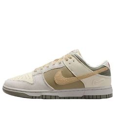 The Nike Dunk Low combines retro flair with modern comfort. Crafted from a mix of leather and textile, these kicks pay homage to '80s basketball aesthetics. The padded, low-cut collar ensures all-day comfort, whether you’re hitting the court or strolling the streets. The colorway features a sophisticated blend of Coconut Milk, Sesame, Alabaster, Light Bone, Neutral Olive, and Dark Stucco. With its extra Swoosh on the heel, this Dunk Low is a stylish nod to the past, perfect for sneaker enthusias Nike Retro Sneakers For Skateboarding, Nike Retro Skate Shoes For Streetwear, Retro Basketball Shoes With Gum Sole And Round Toe, Retro Basketball Shoes With Gum Sole, Nike Streetwear Basketball Shoes With Gum Sole, Nike Throwback Streetwear Skate Shoes, Nike Brown Basketball Shoes For Streetwear, Vintage Basketball Shoes With Boost Midsole For Streetwear, Cream Leather Sneakers For Streetwear