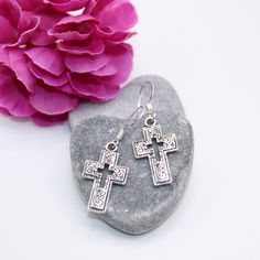 Handmade Tibetan antique silver cross earrings with 925 Sterling silver hooks. These earrings would be a fabulous addition to anyone's earring collection. Detailed on both sides and finished with 925 Sterling silver hooks. Matching cross necklace available  Made with   ⭐Tibetan antique silver cross charm ⭐925 Sterling silver ear hooks Finished with rubber bell shaped stoppers presented on a beautiful floral and birds card All earrings are lead and nickel free Please do not wear these earrings wh Silver Cross Earrings, Earring Collection, Cross Earrings, Lovely Earrings, Cross Charms, Cross Pendant Necklace, Earrings Collection, Silver Cross, Sterling Silber