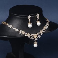 Elegant and sophisticated bridal necklace set with a gold finish Features micro-inlaid zircon and pearl for a stunning and luxurious look Perfect accessory for weddings, evening parties, and hosting events Suitable for brides, bridesmaids, and anyone looking to add a touch of elegance to their outfit Versatile design that can be paired with a variety of wedding dresses and evening gowns High-quality construction and materials for lasting durability Necklace size: approximately 16.1 inches (41 cm Gold Bridal Necklace Set, Hosting Events, Gold Bridal Necklace, Handmade Jewlery, Bridal Necklace Set, Necklace Size, Romantic Style, Bridal Necklace, Marie Antoinette